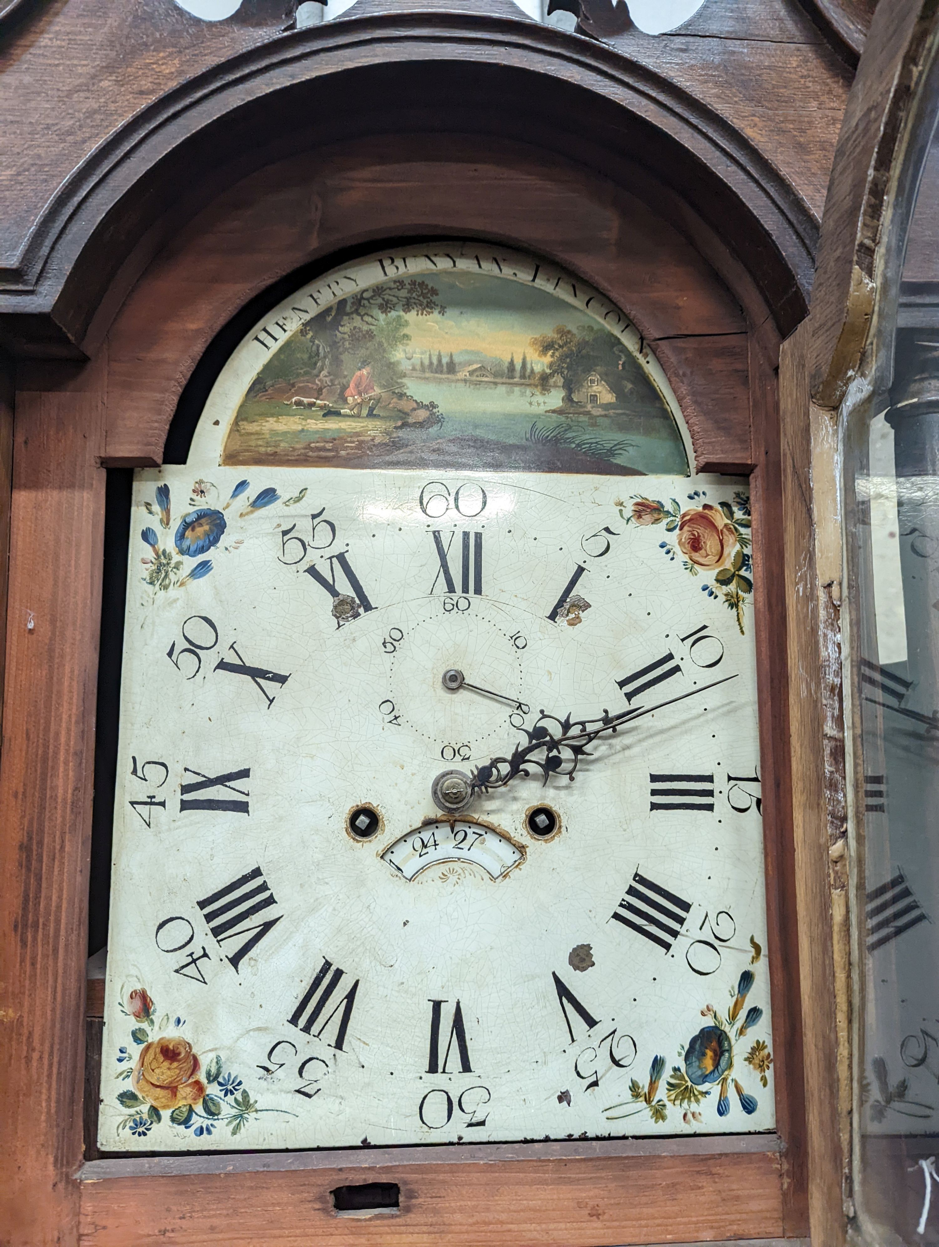 An early 19th century oak eight day longcase clock, the painted dial marked Henry Bunyan, Lincoln, (case in two sections) height 224cm